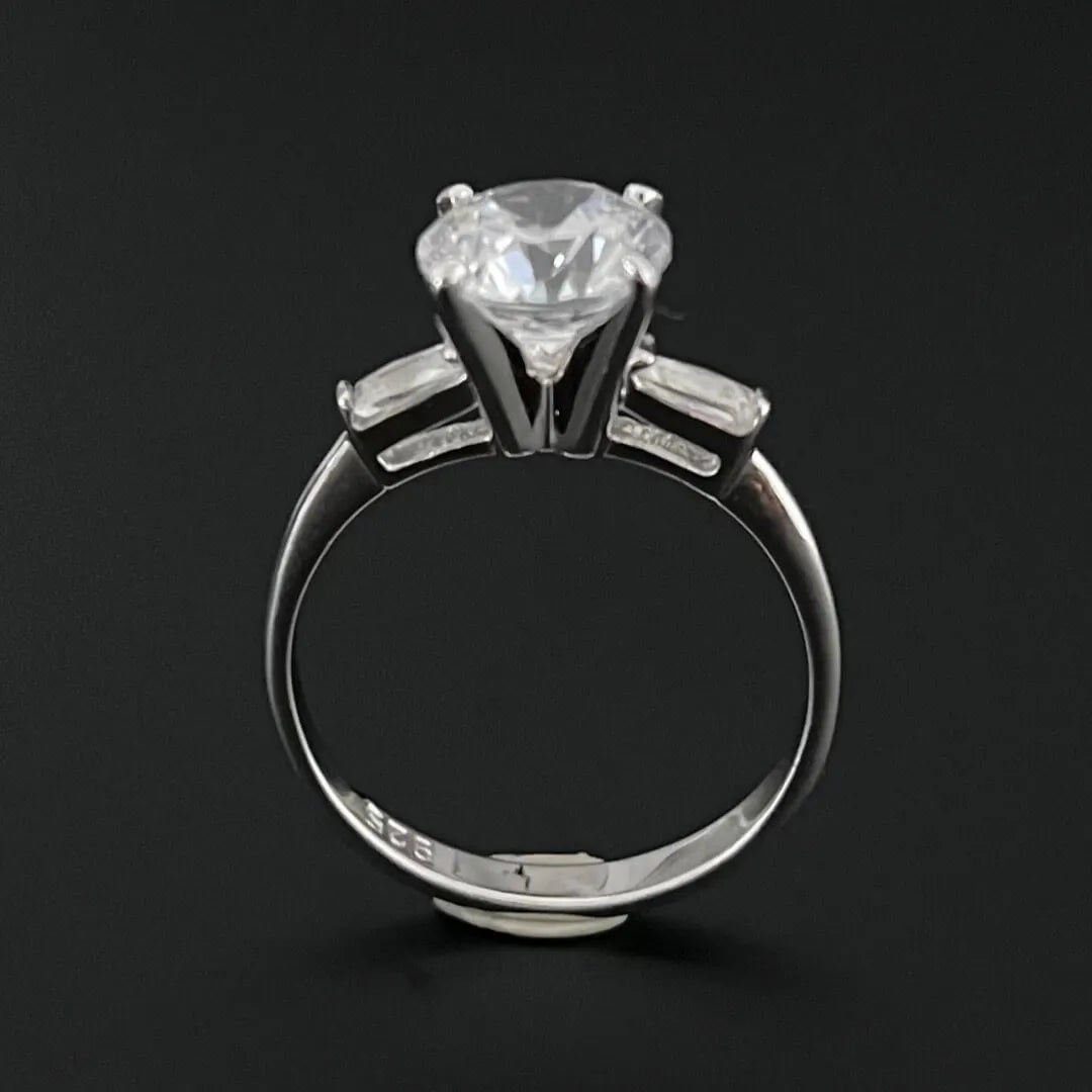 2 CARAT SOLITAIRE FLANKED BY BAGUETTE DIAMONDS WITH PLAIN BAND