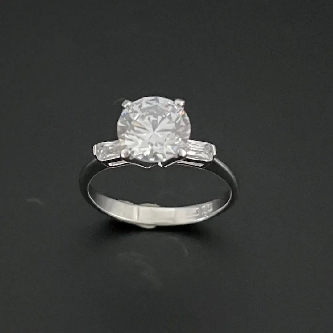 2 CARAT SOLITAIRE FLANKED BY BAGUETTE DIAMONDS WITH PLAIN BAND