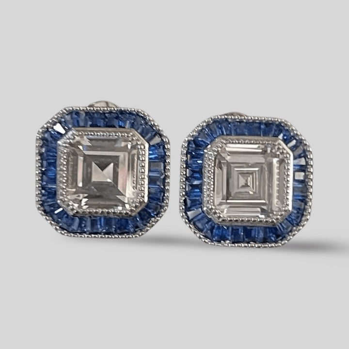 ASSCHER CUT DIAMOND WITH BLUE BAGUETTE HALO STUD